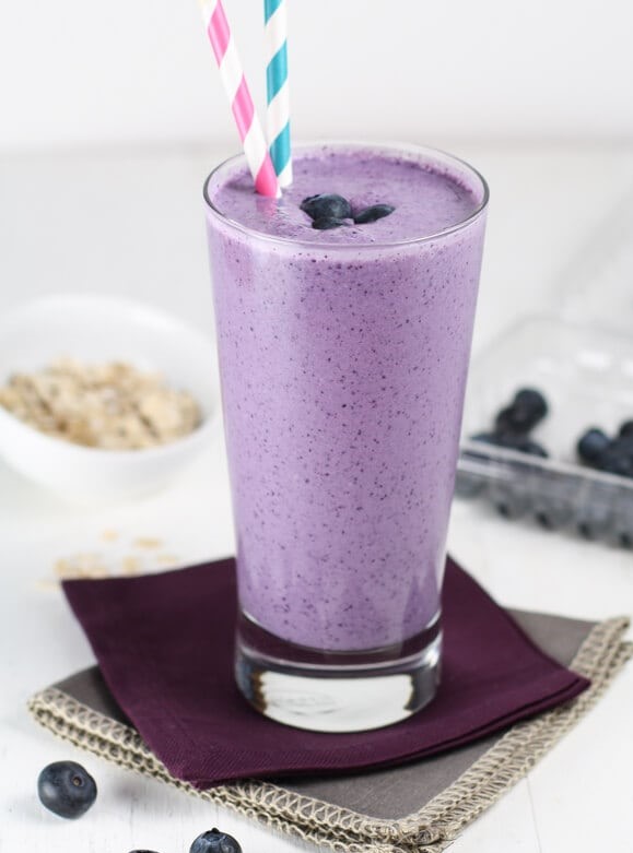 image of bluerries and oatmeal smoothie in a glass